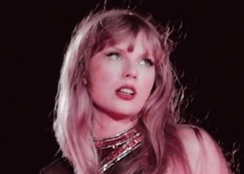 taylor swift during the reputation set of the eras tour, with a custom filter